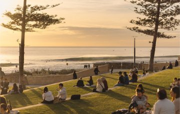 People enjoying a sunset at Scarborough Beach